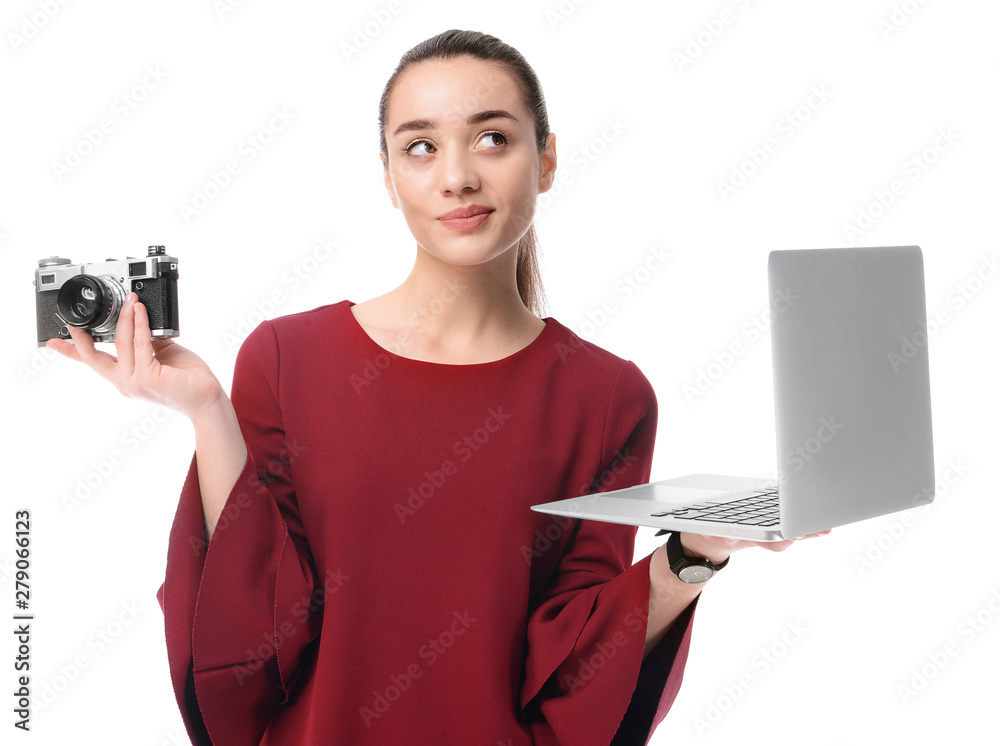 Thoughtful businesswoman with laptop and photo camera on white background Thoughtful businesswoman with laptop and photo camera on white background