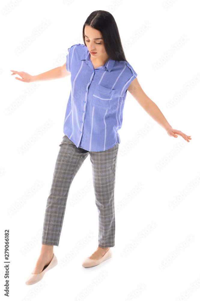 Balancing young businesswoman on white background Balancing young businesswoman on white background