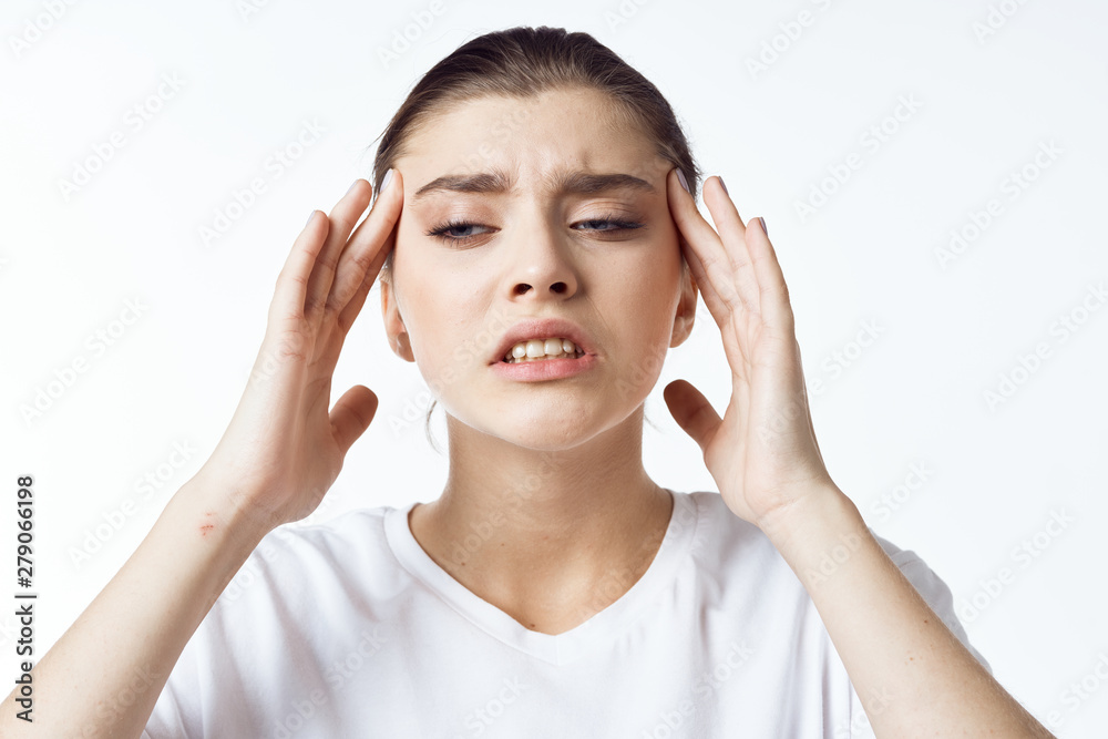 young woman with headache isolated on white young woman with headache isolated on white