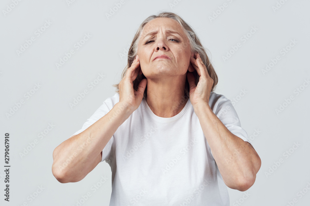 senior woman with headache isolated on white senior woman with headache isolated on white
