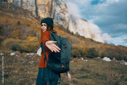 woman with backpack in mountains © SHOTPRIME STUDIO