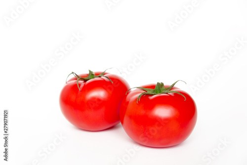 Two ripe fresh red tomatoes isolated on white background, side view