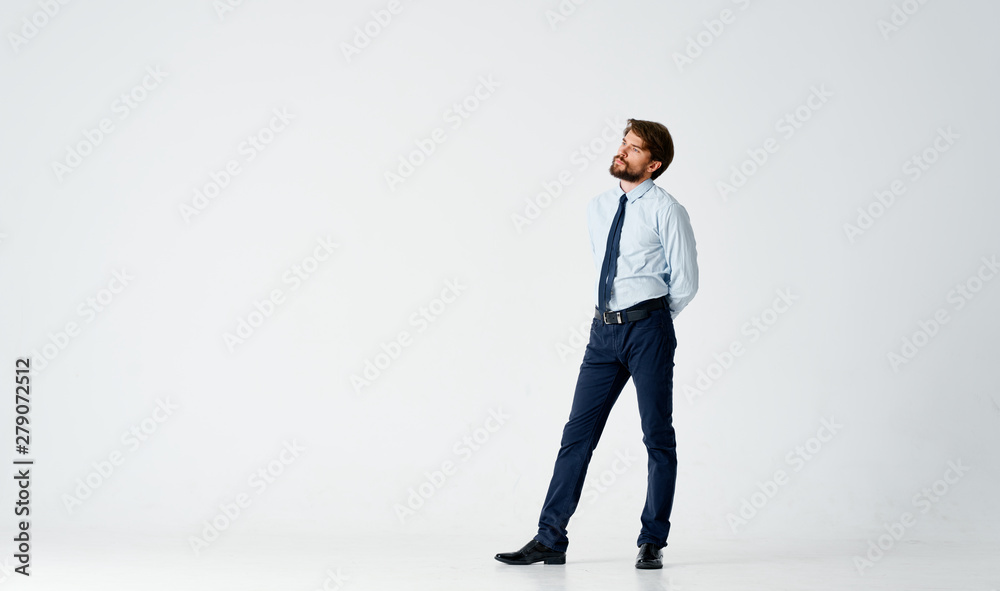 businessman standing in front of wall businessman standing in front of wall