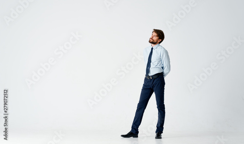 businessman standing in front of wall