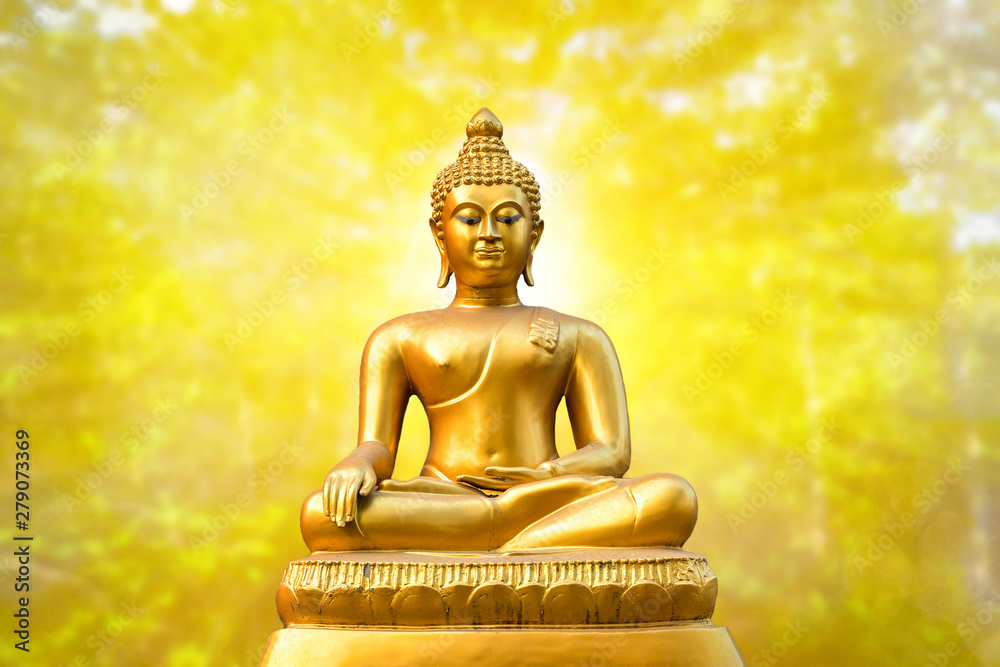 Beautiful of Golden Buddha statue on golden yellow bokeh background. Stock  Photo