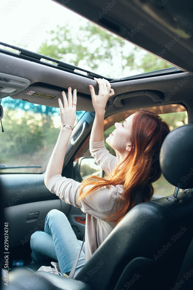 Fototapeta premium young woman in car