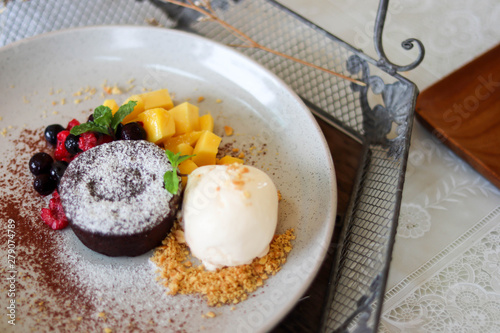 Delicious and beautiful dessert of .Chocolate cake with summer berries,mango.