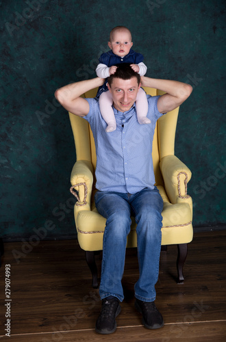 Father and Daughter Posing on Armchair in Studio © Samumneo