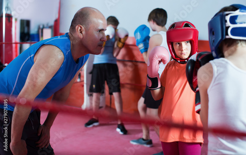  Teenagers training at boxing workout on boxing ring