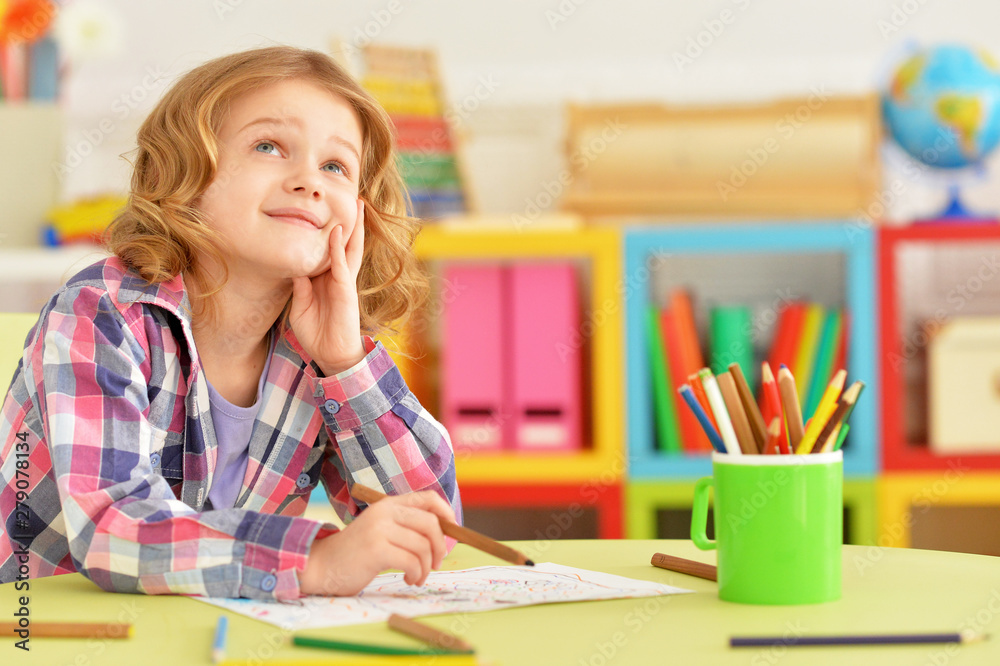 Portrait of cute smiling girl posing and drawing at home Portrait of cute smiling girl posing and drawing at home