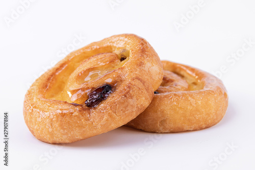 Two tasty puff pastry rolls with honey on top © JeanPaul