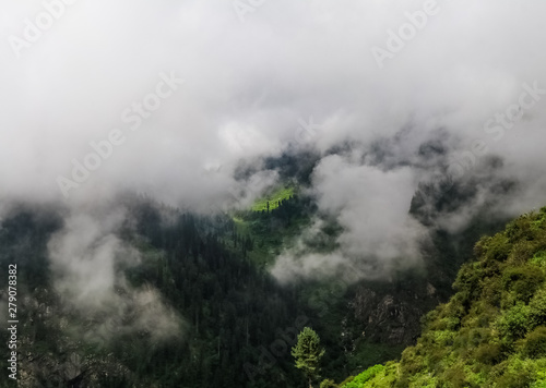 clouds in and over mountains