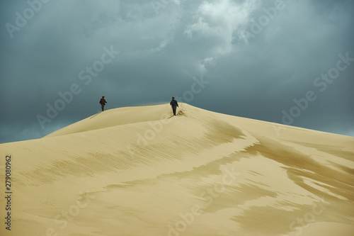 Tourist walking to Dunes photo