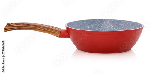 Heavy red frying pan isolated on white background