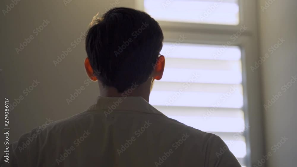 Doctor or lab person looking at the sun through hospital or lab window Doctor or lab person looking at the sun through hospital or lab window