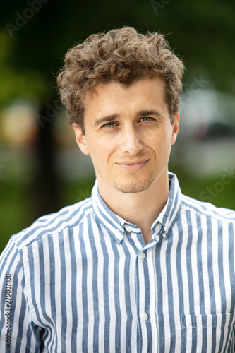 portrait of a young man outside photo