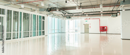 Empty large clean corridor hall space of office building skyscraper with window wall facade, modern white business interior architecture highrise background with copy space © ZETHA_WORK