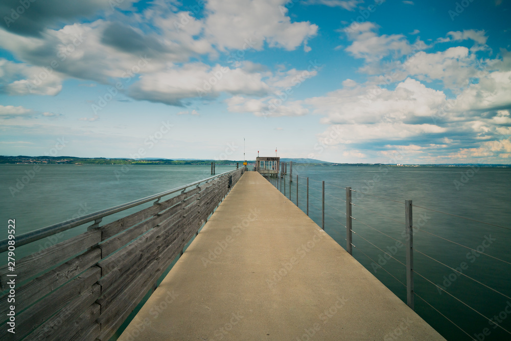 long exposure of the concrete pier in Altnau leading out into Lake Constance