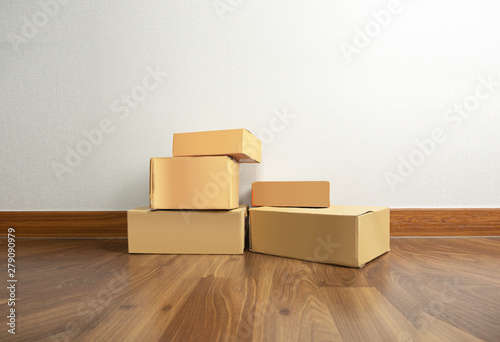 Parcel packaging boxes on home floor © kaipong