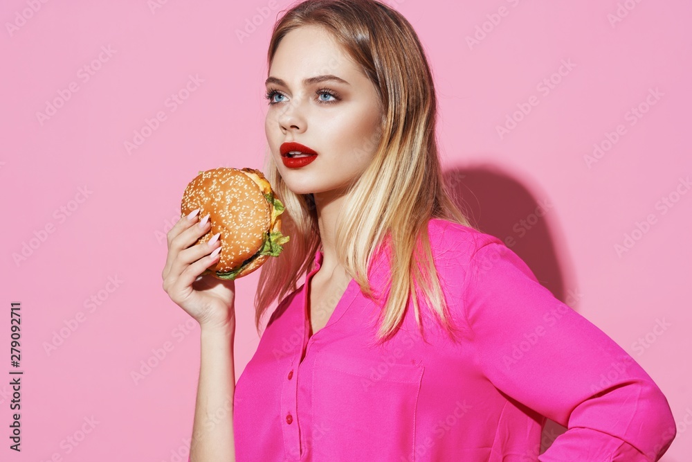 portrait of young woman with hamburger portrait of young woman with hamburger