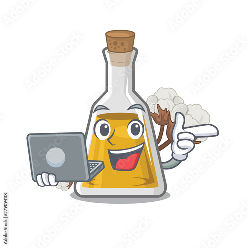 With laptop cottonseed oil in a mascot bottle photo