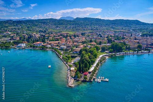 Fototapeta Naklejka Na Ścianę i Meble -  Aerial photography with drone. Beautiful coastline. In the city of Bardolino, Lake Garda, Italy.