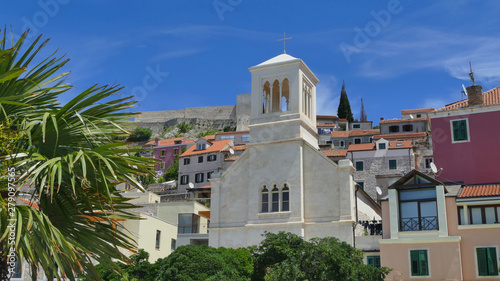 Colourful historic city of Sibenik with palm trees and church  Croatia