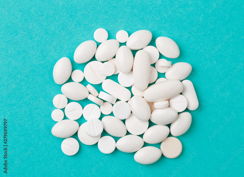 white  tablets on blue  background - Image .
