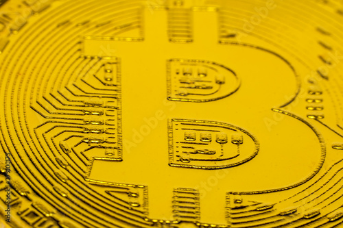 Bitcoins and New Virtual money concept.Gold bitcoins with Candle stick graph chart and digital background.Golden coin with icon letter B.Mining or blockchain technology