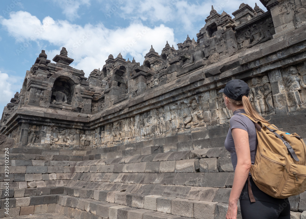 Tourist backpacker exploring the Borobudur temple in Java island,Indonesia