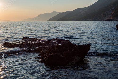 Beautiful sunset with rocks in the Adriatic sea, Dingac Borak, Dalmatia, Croatia, Peljesac peninsula photo