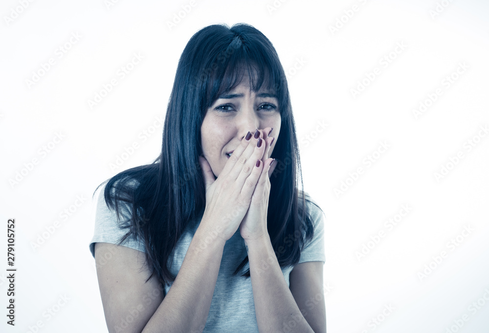 Portrait of a young attractive woman looking scared and shocked.Human expressions and emotions Portrait of a young attractive woman looking scared and shocked.Human expressions and emotions