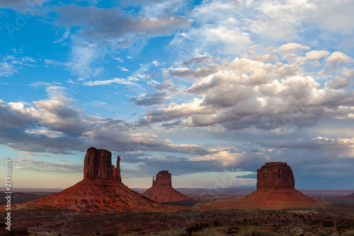 The famous Merrick and Mittens Buttes from monument valley basking in the Light of the setting sun.