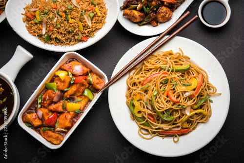 Assorted Indo chinese dishes in group includes Schezwan/Szechuan hakka noodles, veg fried rice, veg manchurian, american chop suey, chilli paneer, crispy vegetable and vegetable soup