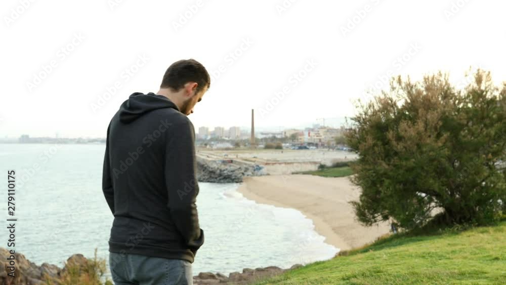 Sad teen walking complaining looking at city outskirts Sad teen walking complaining looking at city outskirts