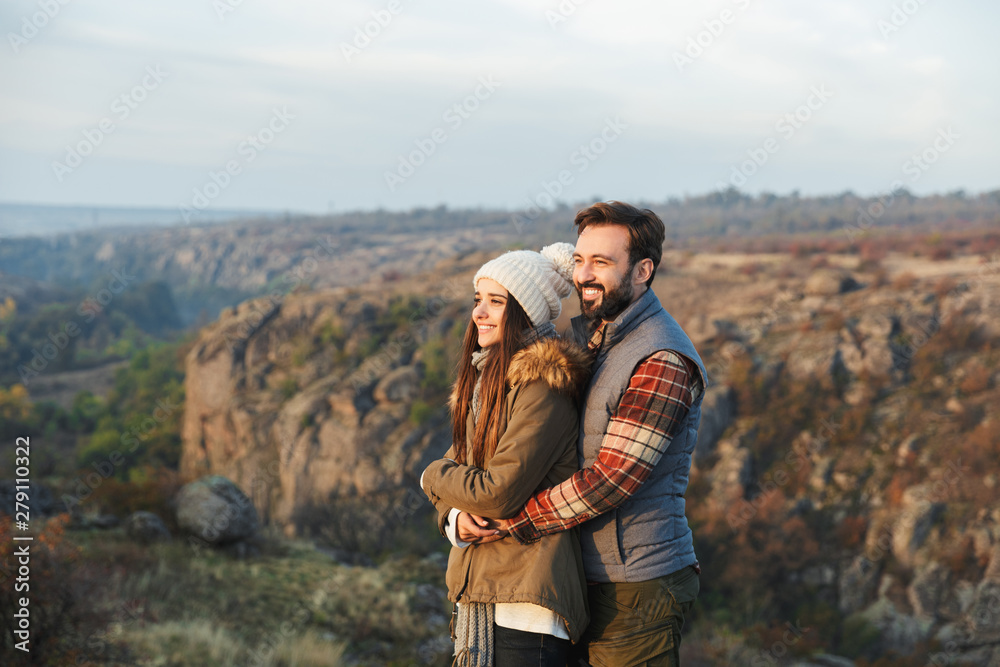 Amazing emotional happy young loving couple outside in free alternative vacation camping over mountains.