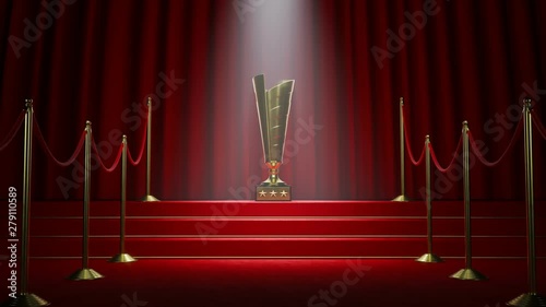 Golden movie award standing in a spotlight on the red carpet stairs. 4KHD photo