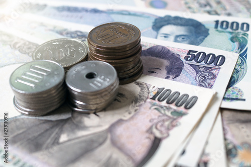 Japanese yen notes and Japanese yen coins for money concept background. photo