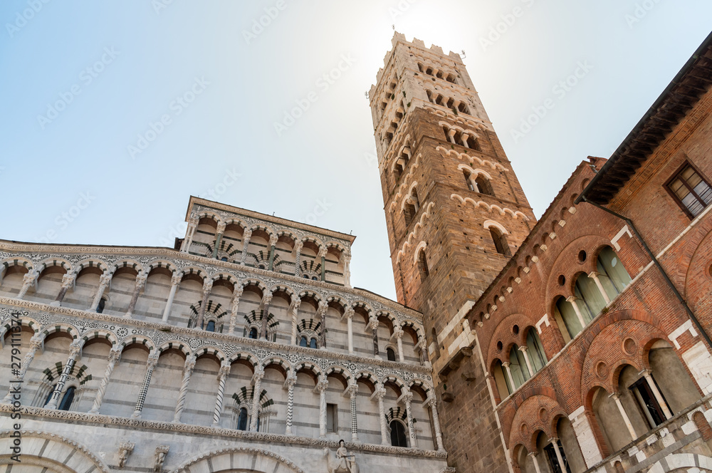 Romanesque Facade and bell tower of St. Martin Cathedral in Lucca, Tuscany.
