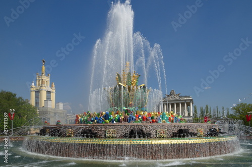 Moscow, Russia - may 7, 2019: Fountain "Stone flower" on the background of pavilions "Grain" and "Optics" at VDNH