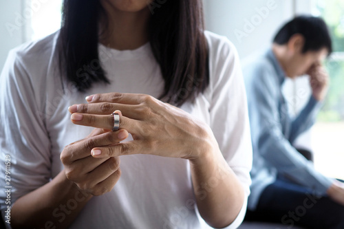 Couples have a relationship problem after quarreling, offended. The wife took the wedding ring and decided to quit and divorce. © Shisu_ka