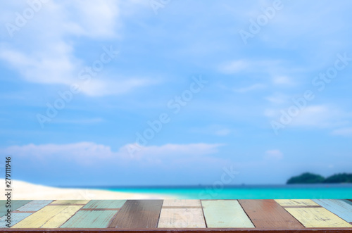 the wood table on blurred sea with background - Empty ready for your product display montage. Concept of beach in summer. vintage color tone.