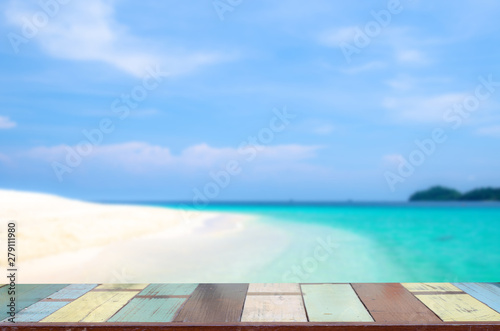 the wood table on blurred sea with background - Empty ready for your product display montage. Concept of beach in summer. vintage color tone.