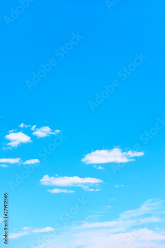 Blue sky with white clouds - vertical background