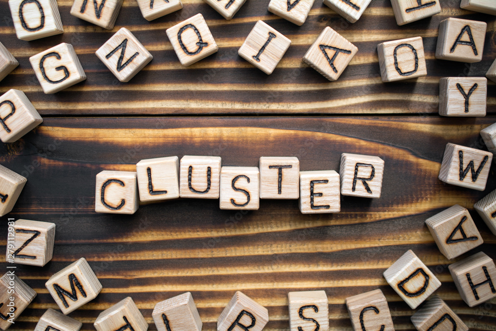 cluster wooden cubes with letters, a group of competitive businesses or loosely coupled computers that work together concept, scattered around the cubes random letters, top view on wooden background cluster wooden cubes with letters, a group of competitive businesses or loosely coupled computers that work together concept, scattered around the cubes random letters, top view on wooden background
