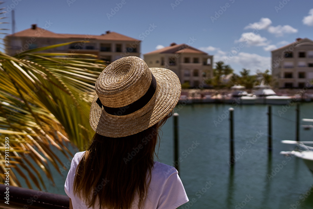 young woman in straw hat