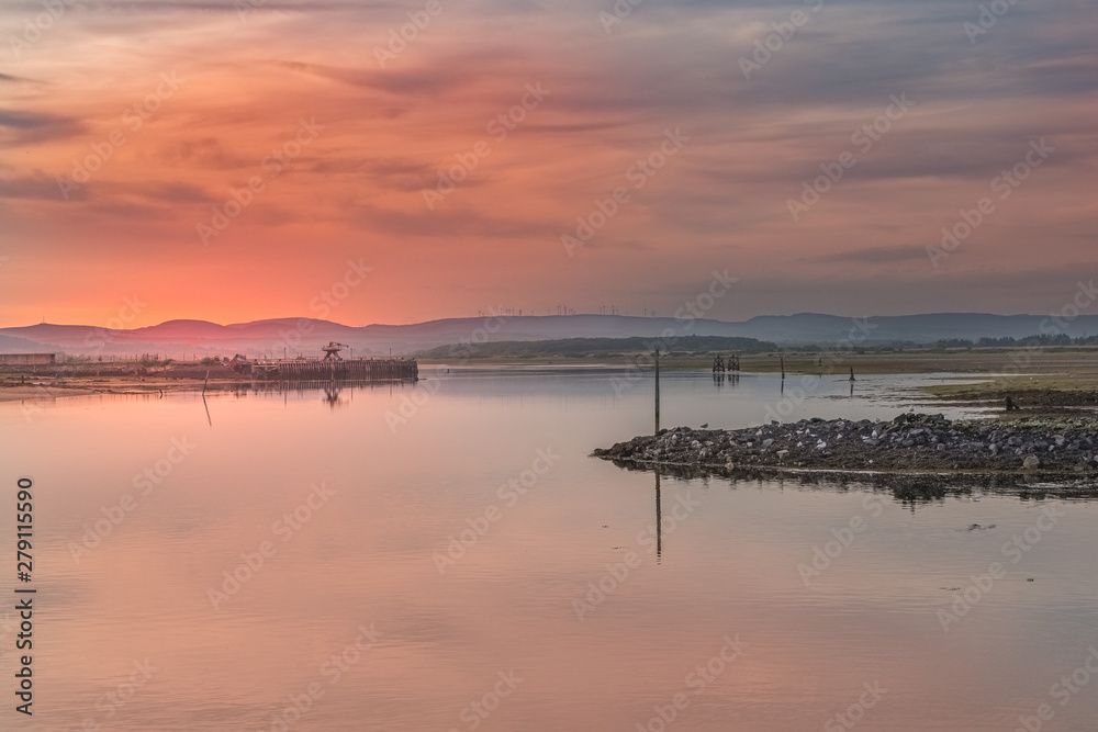 Sunset over Irvine Harbour in Ayrshire Scotland looking over to Ardeer Peninsula on a Clam Summers Evening in Scotland