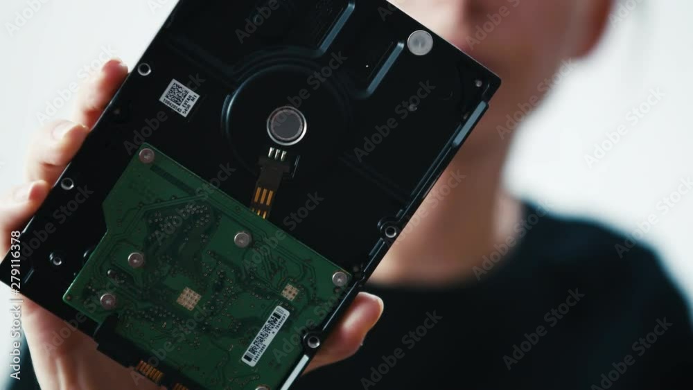 Internal computer harddisk storage space held in hand, close up shot Internal computer harddisk storage space held in hand, close up shot