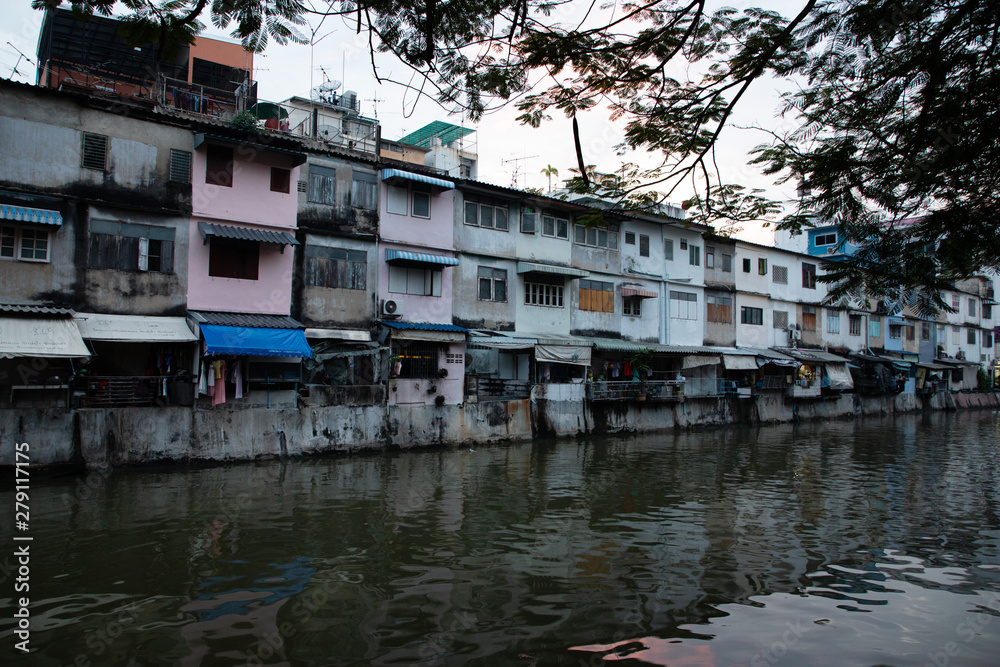 Front view of old buildings over a river in Bangkok