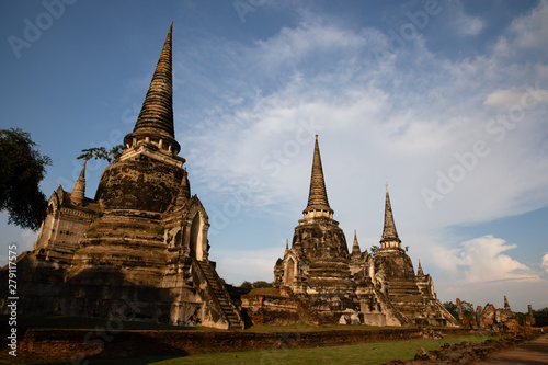 Distant view of the Ayutthaya ruined temple in Thailand with the blue sky as background